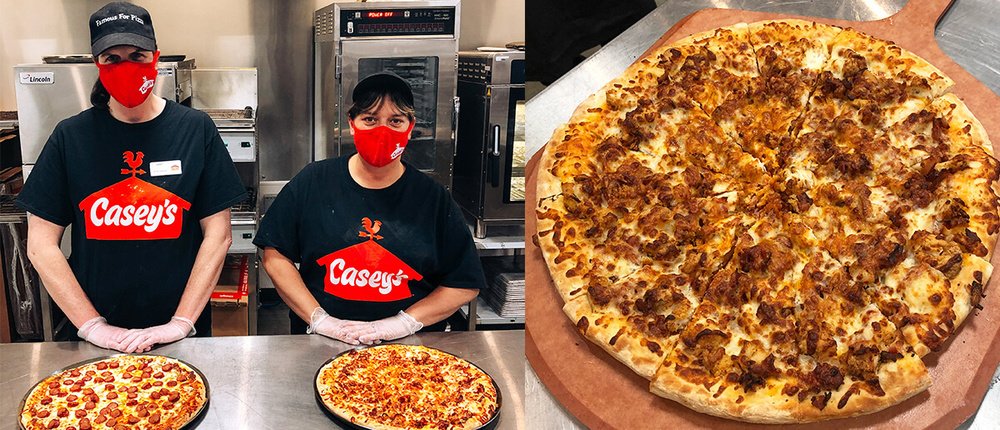 Two Casey's Team Members with their creative pizza creations