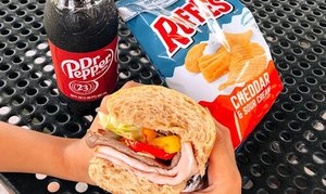 Dr Pepper, Ruffles chips, and sub sandwich picnic